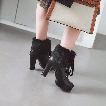 Chic Black Faux Leather Ankle Boots With Plush Fur..