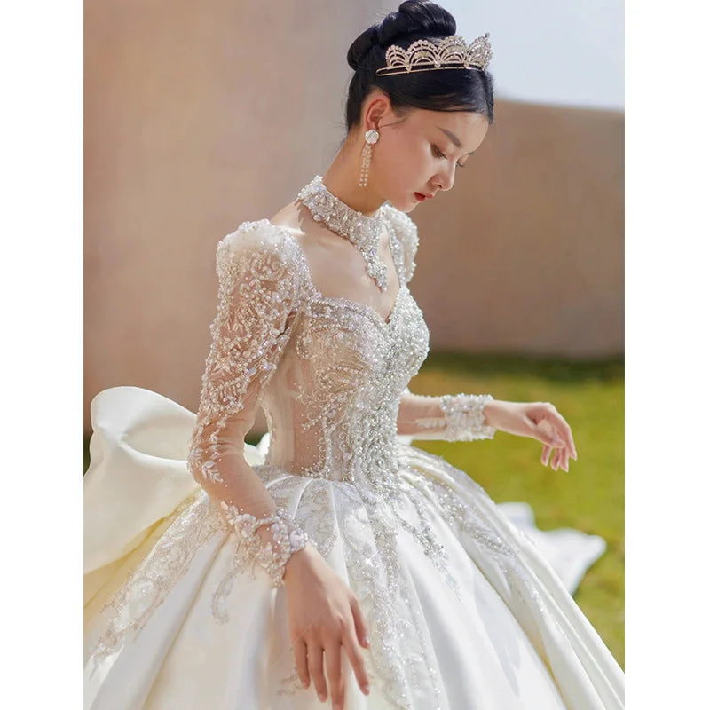 Elegant Ball Gown Wedding Dress with Long Sleeves and Beads Lace Appliques main image 0