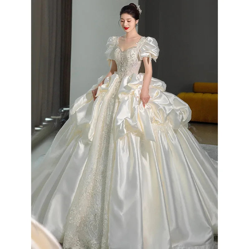Elegant Satin Bridal Gown With Shimmering Lace Detail on Luulla