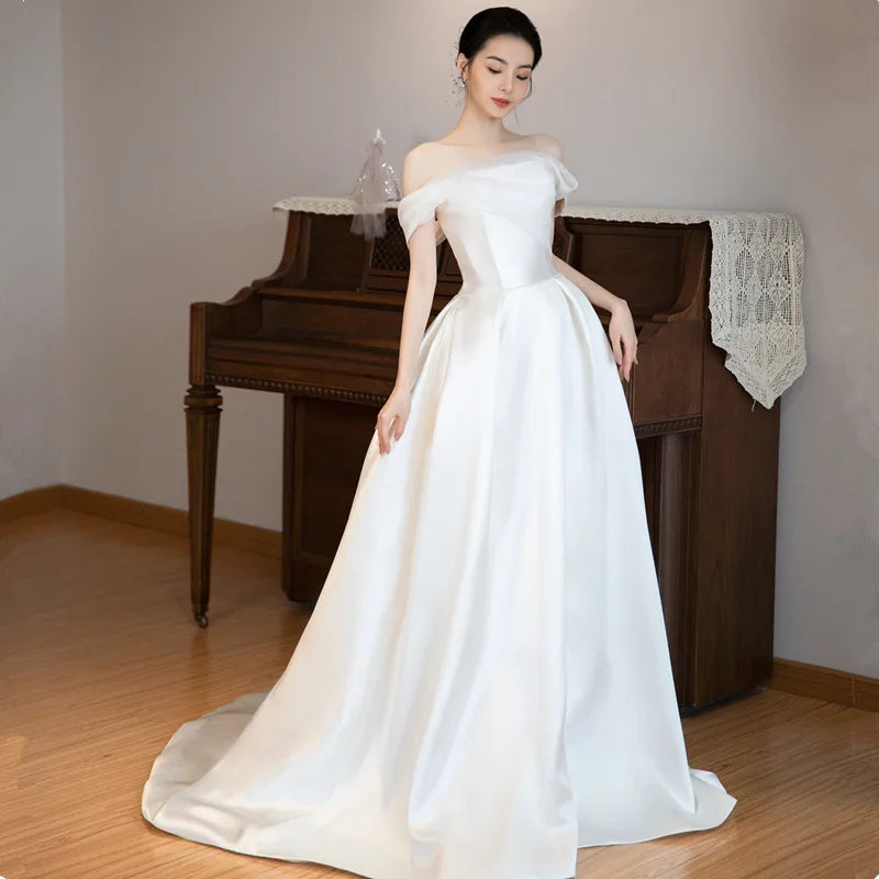 Elegant White A-Line Gown with Off-the-Shoulder Sleeves for a Romantic Touch
